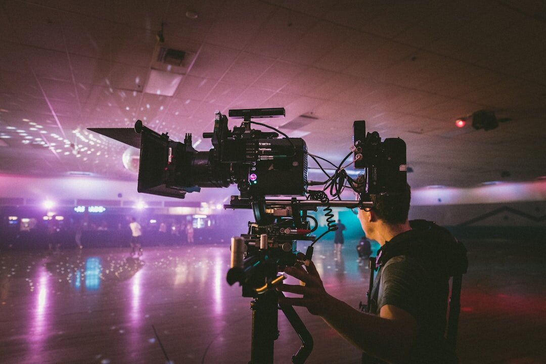 Video production team filming in a modern studio environment